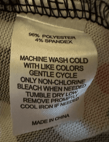 "Made in China", and "96% polyester 4% spandex" printed on the sewn-in side seam label