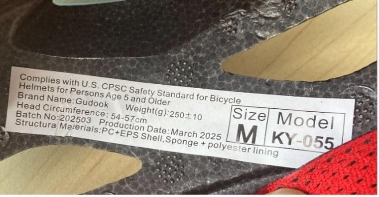 "Model KY- 055" , "Batch No: 202503" and "Production Date: March 2025" are printed on a label on the inside of the recalled Gudook bicycle helmet