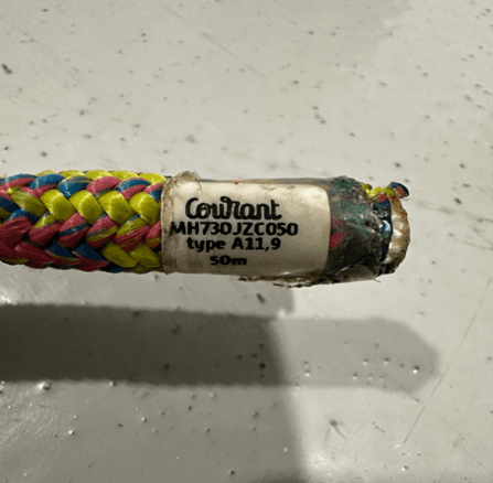 Tag on end of climbing rope (lollipop color) showing brand, part number, type and length
