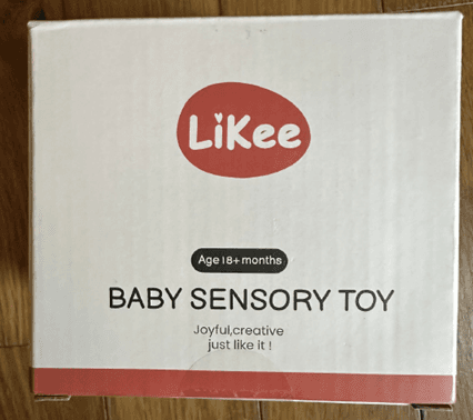 "LiKee" and "Baby Sensory Toy" are printed on the front of the teething toy packaging