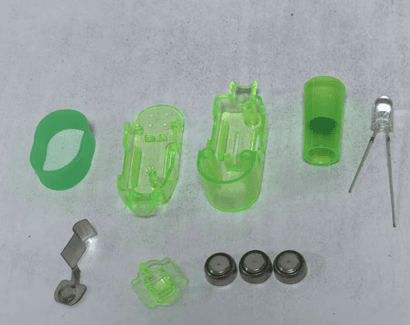 The recalled Oitnlaughter finger lights have three internal button cell batteries that power animal projections