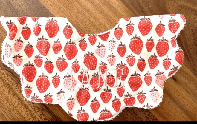 Recalled bib with strawberry print