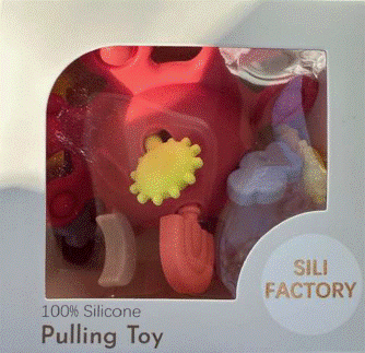 "Sili Factory" and "Pulling Toy" printed on the front of the recalled teething toy packaging