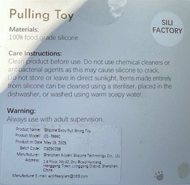 Manufacturer information printed on the back of the recalled teething toy packaging