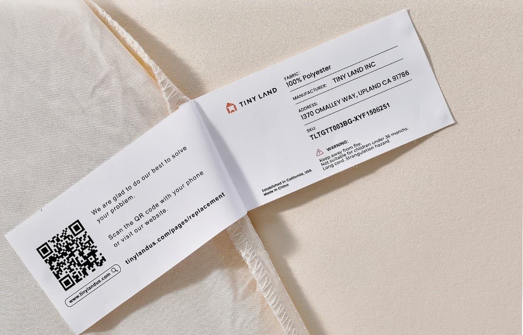 The Tiny Land logo and batch number TLTGTT003BG-XYF1506251 are printed on a label stitched on inside of the recalled play tent