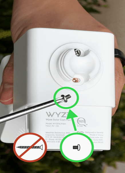 The short pan-head screws should be used to attach the solar panel to the camera. The long flat-head screws are for mounting the unit to the side of a hous