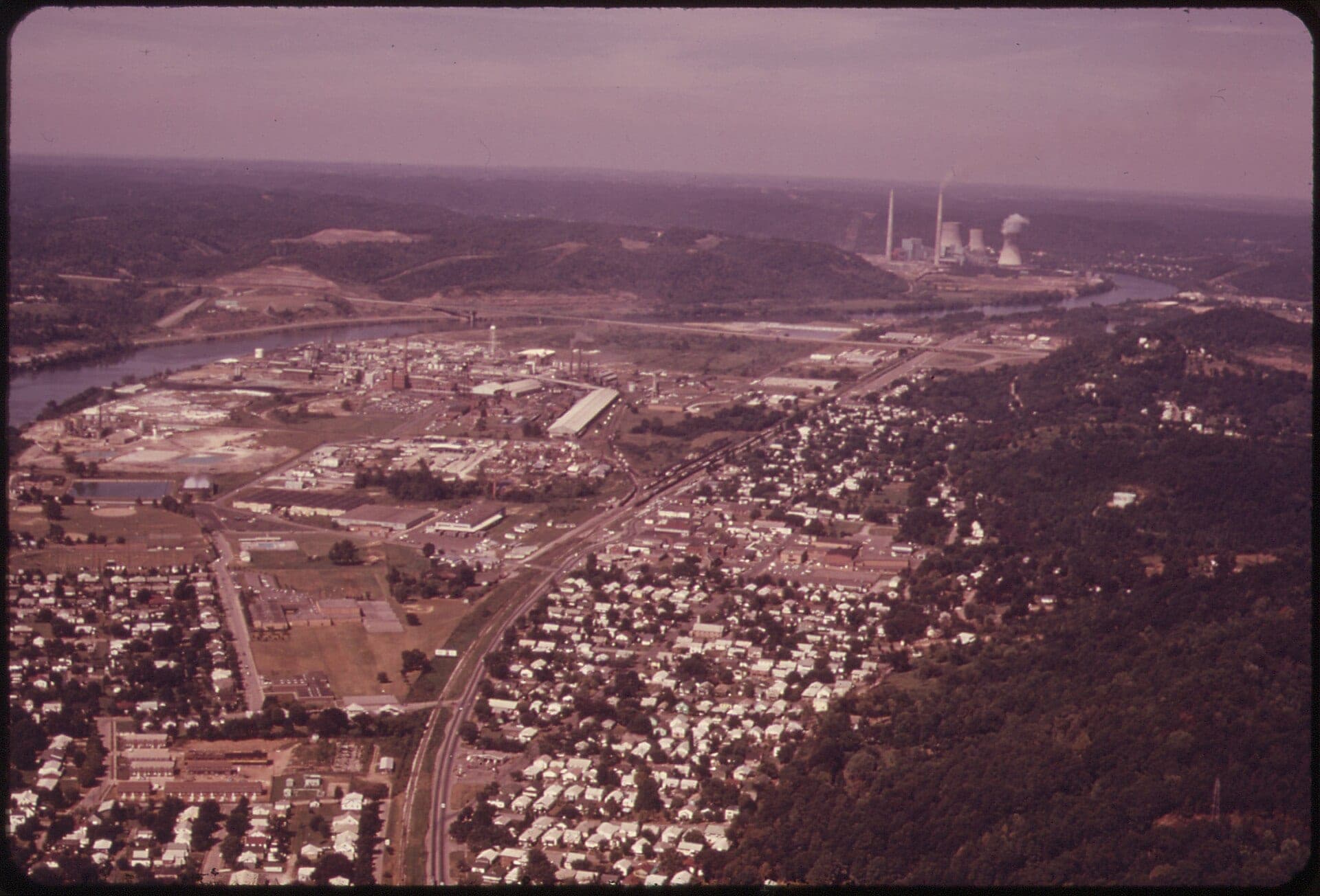 Aerial view of chemical processing plants along the Kanawha River at Nitro, West Virginia, set within the Appalachian valley industrial corridor.