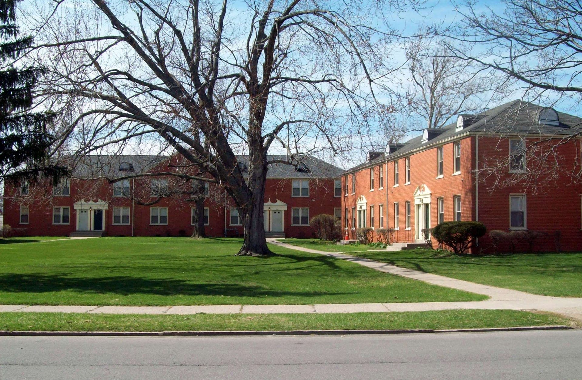 A garden-style apartment complex exterior, daytime