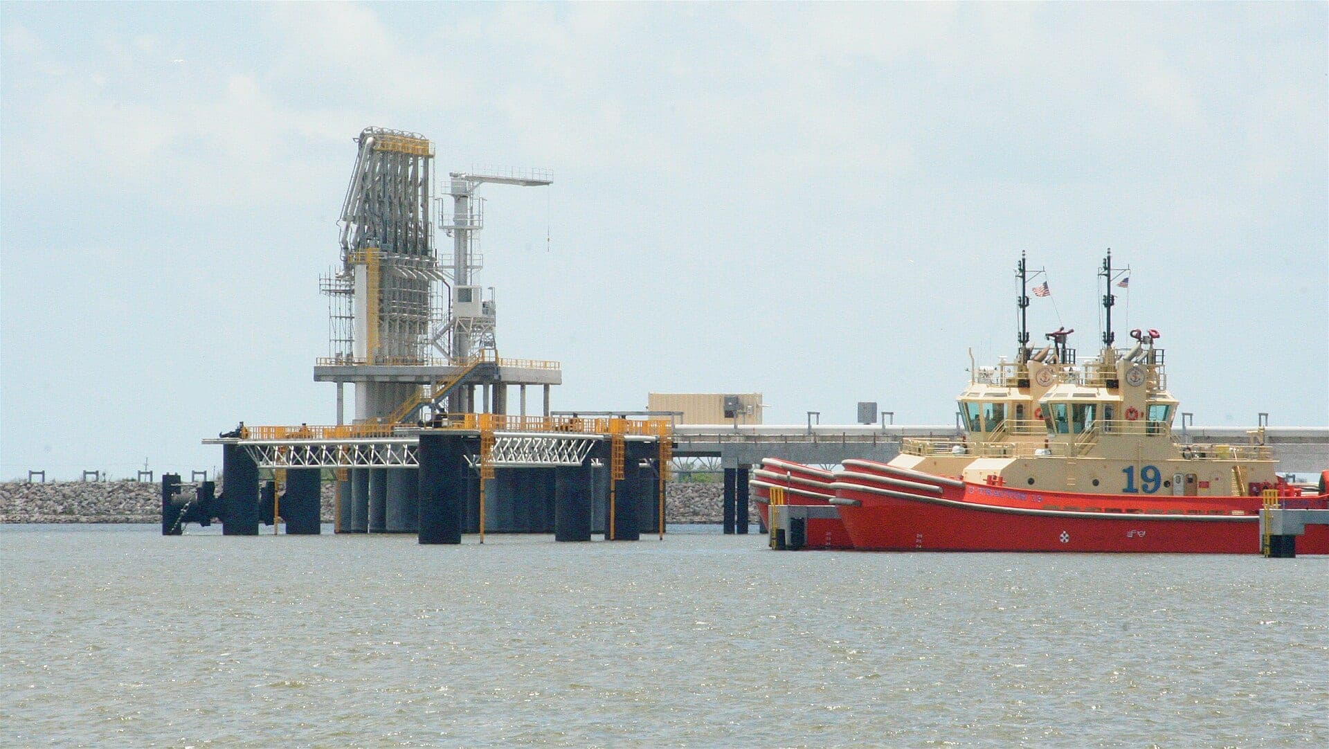 A liquefied natural gas marine loading terminal and a support vessel in Gulf Coast waters near Sabine Pass on the Louisiana coast.