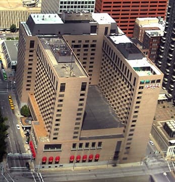 The Hyatt Regency St. Louis at the Arch hotel exterior on a clear day, viewed from the street.