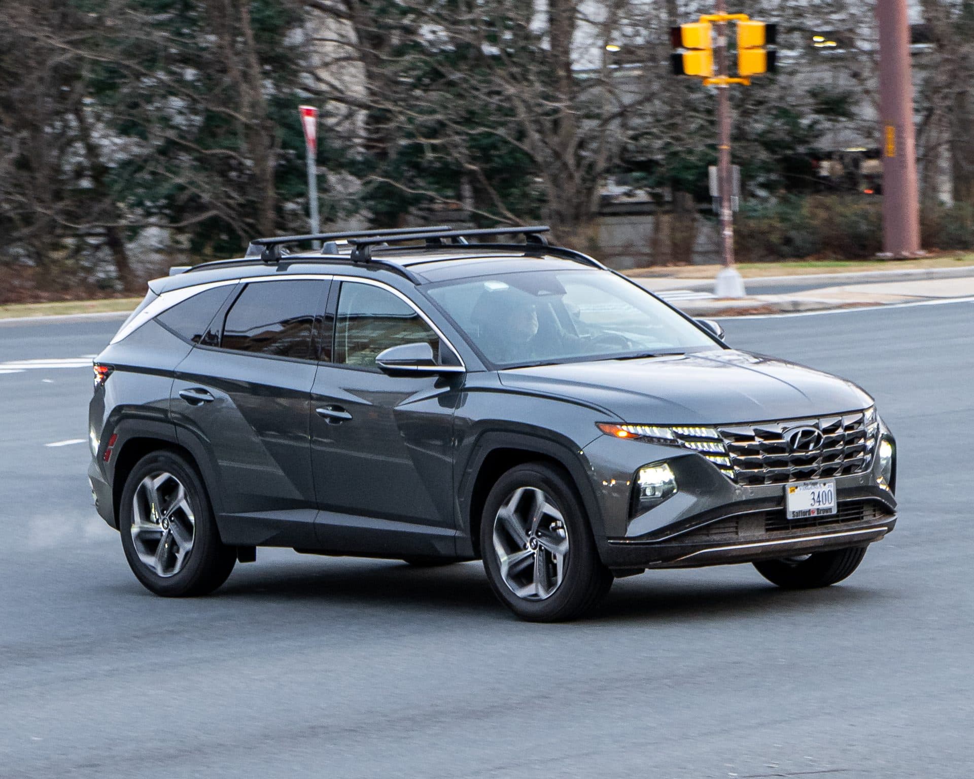 A gray Hyundai Tucson SUV (NX4 generation) on a street in the Washington, D.C. metro area — the model line covered by the Hyundai recall over phantom-braking events