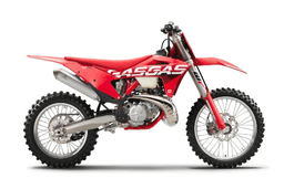 A red GASGAS off-road motorcycle photographed from the left side against a white background, with white GASGAS lettering on the radiator shroud, knobby off-road tires, long-travel front forks, and an upswept exhaust pipe.