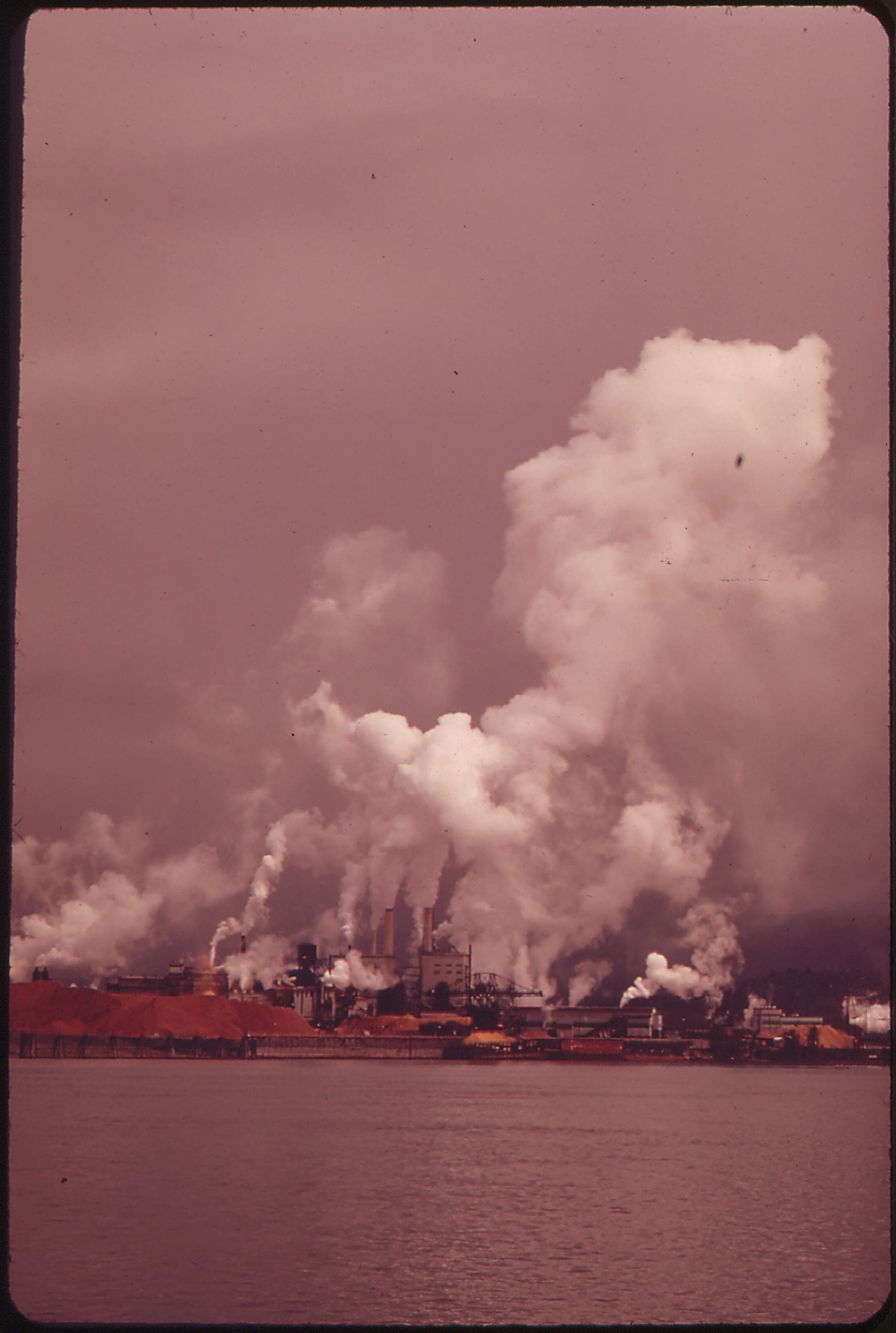 Paper mill complex at Longview, Washington on the Columbia River, with multiple smokestacks emitting steam