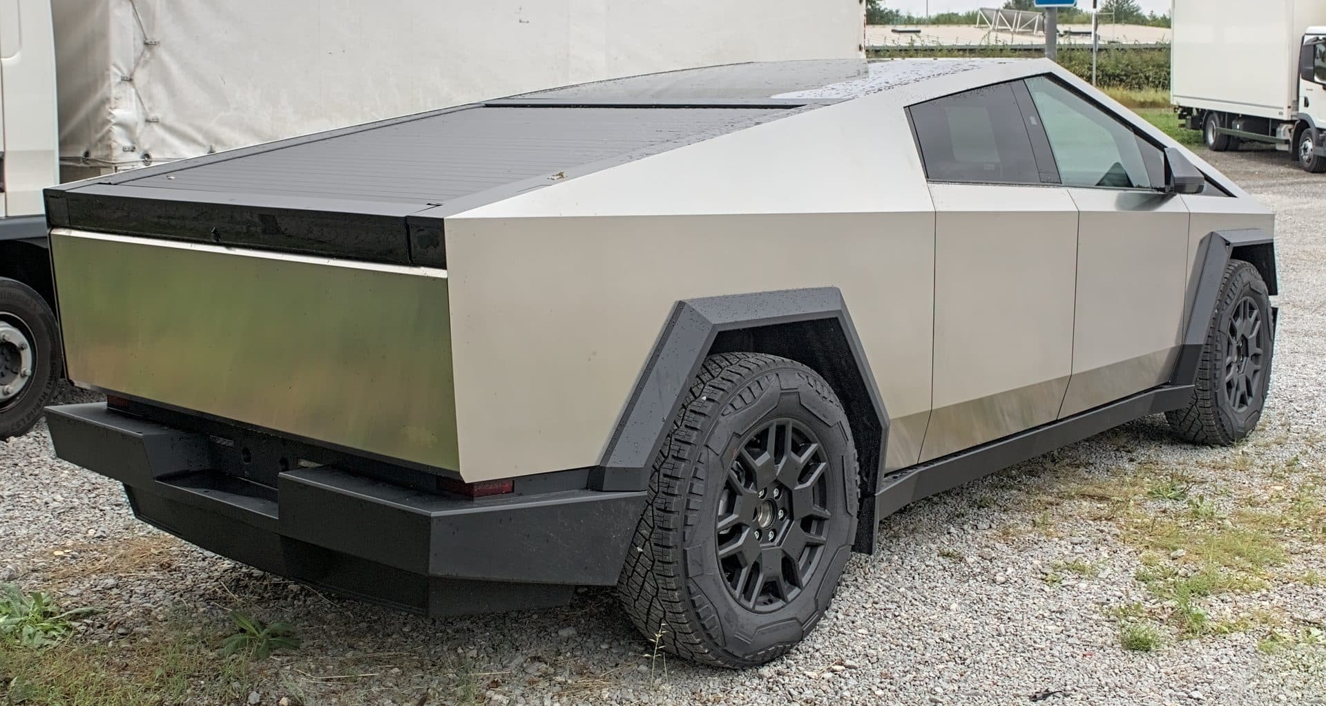 A 2024 Tesla Cybertruck Foundation Series, rear three-quarter view of the stainless-steel exterior — the model line covered by Tesla's recall over a steel wheel and brake-rotor stud defect